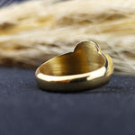 Load image into Gallery viewer, Honor your ancestry with this exquisite gold-plated crest ring, featuring a recessed engraving of a noble emblem. The unique shape and meticulous craftsmanship make it a distinctive and meaningful piece of heritage jewelry. A refined accessory for men who embrace tradition, this signet ring is a remarkable tribute to lineage and timeless craftsmanship.
