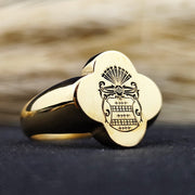 A one-of-a-kind heirloom ring, this gold-plated signet piece showcases a recessed engraving of a noble family crest. The unique shape and deep engraving make it a standout piece of heritage jewelry. Designed for men who value tradition and sophistication, this ring is an elegant addition to any collection, perfect for commemorating lineage and personal history.
