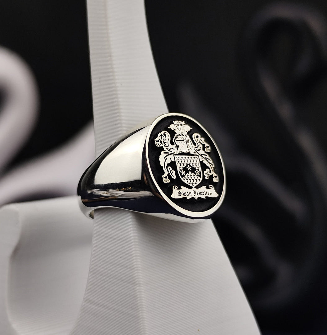 Gold coat of arms ring, crafted for men with custom engraving of a family crest. This unique piece serves as a beautiful reminder of family legacy, suitable for both daily wear and special occasions.