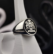 Gold coat of arms ring, crafted for men with custom engraving of a family crest. This unique piece serves as a beautiful reminder of family legacy, suitable for both daily wear and special occasions.