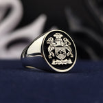 Load image into Gallery viewer, Custom family crest ring for men with detailed coat of arms engraving in gold, representing family heritage. A sophisticated choice for honoring ancestry and carrying family pride daily.
