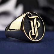A stunning 14K gold name and surname ring with an intricate monogram engraving, designed as a seal-style statement piece. This elegant and luxurious ring is perfect for men or women who value fine craftsmanship and personal symbolism. It captures the beauty of gold with a lasting message in a unique and wearable form.