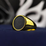 Load image into Gallery viewer, Minimalist gold-filled ring with a black oval design, suitable for both men and women. This ring adds elegance to everyday wear.
