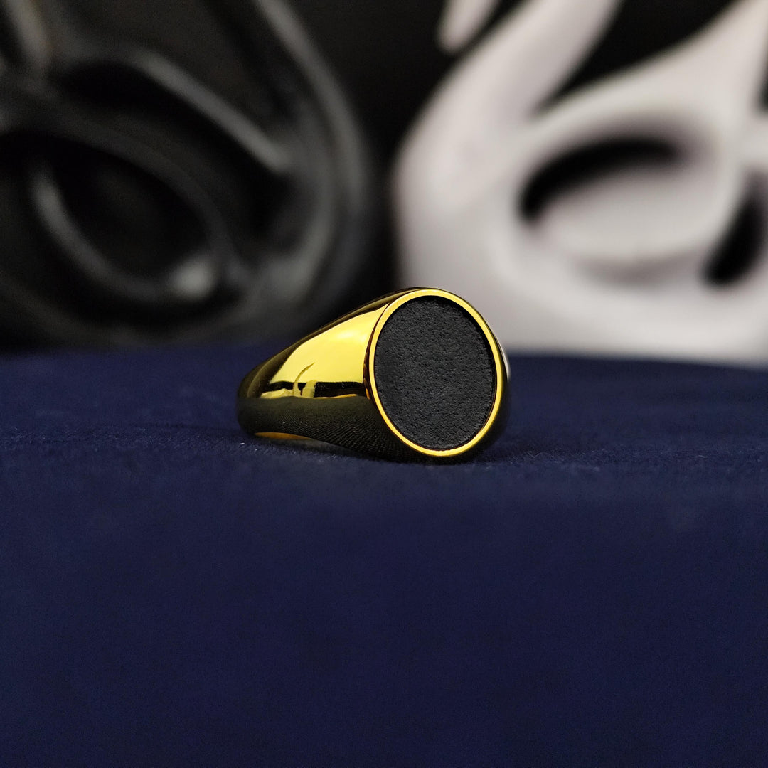 Gold-filled unisex ring with a sleek black oval design, perfect for men and women. This versatile signet ring combines timeless elegance with modern style.