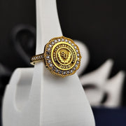 Women’s university ring with a sleek gold-plated finish and a brilliant white stone, designed for elegance and academic pride. Perfect for celebrating graduation milestones with style.