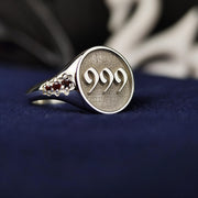 Elegant silver angel number ring featuring a sleek design and a subtle stone accent. This refined piece blends spirituality with modern aesthetics, making it a perfect gift or personal keepsake.