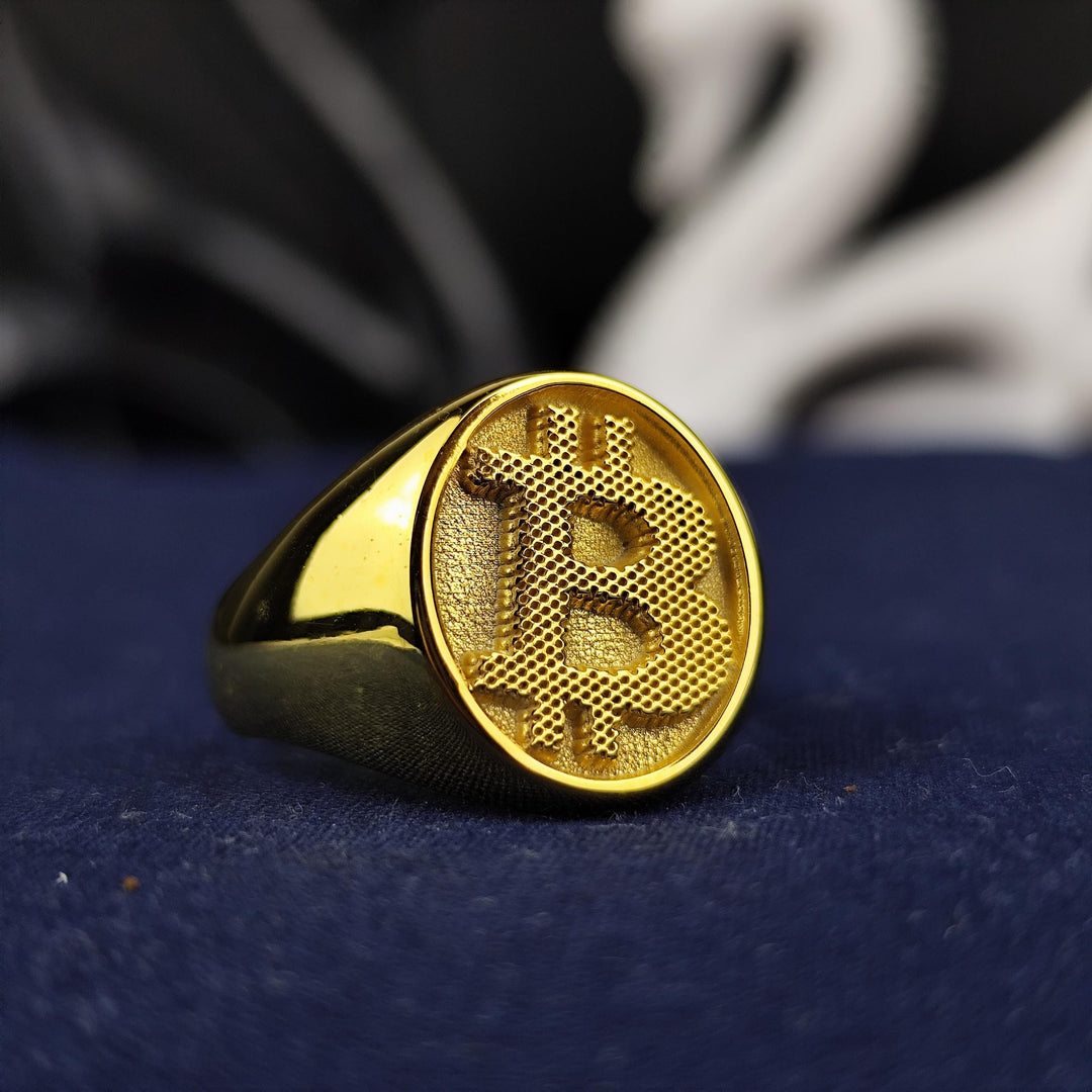 Elegant Bitcoin jewelry ring featuring a polished gold finish and a detailed BTC emblem. A unique accessory for crypto investors and blockchain supporters.