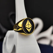 Elegant gold Ethereum ring crafted for blockchain enthusiasts and crypto investors. Featuring a sleek, modern design with high-quality gold plating, this stylish signet ring symbolizes financial innovation and digital wealth. A meaningful statement piece for those who believe in the future of decentralized finance and cryptocurrency. Perfect for everyday wear, special occasions, or as a unique crypto-inspired gift.
