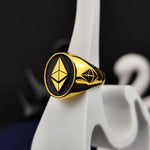 Load image into Gallery viewer, Luxurious Ethereum ring in gold, designed for blockchain enthusiasts who embrace decentralized finance and innovation. This bold and elegant jewelry piece is perfect for crypto investors, traders, and professionals who want to express their passion for digital assets. A must-have for collectors and tech enthusiasts who believe in the power of Ethereum and blockchain technology.
