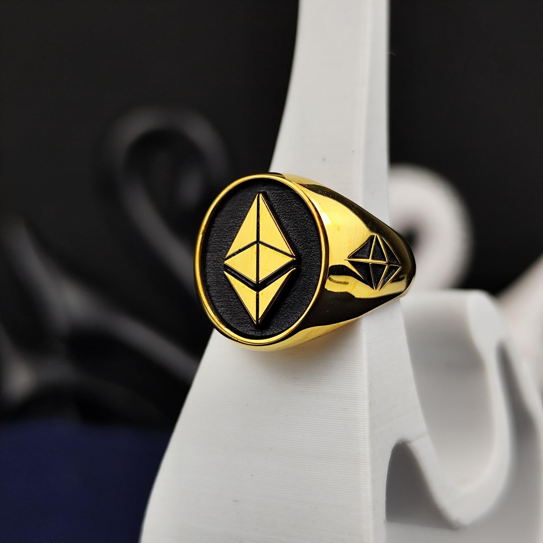 Premium-quality gold Ethereum signet ring with a polished finish, symbolizing the evolution of finance and blockchain technology. Designed for men and women who appreciate stylish crypto jewelry, this unique piece celebrates Ethereum’s impact on the world of decentralized investments. A timeless crypto gift, representing financial empowerment and the future of digital currency.