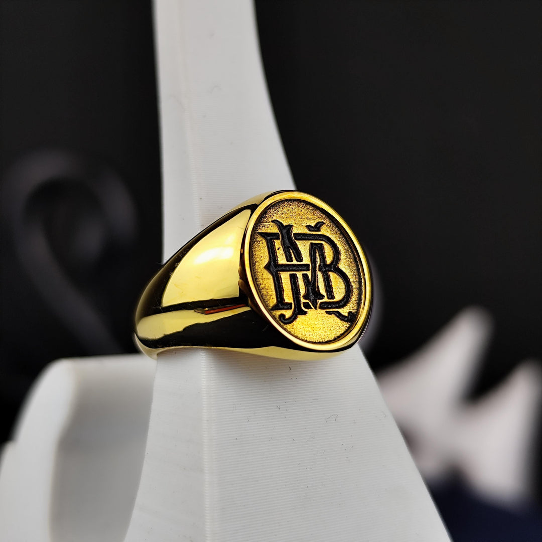 A timeless two-initial name signet ring designed for those who love meaningful jewelry. Handmade in gold or silver, this custom engraved band blends elegance with a personal touch. Whether worn as a daily accessory or a special gift for loved ones, this refined jewelry piece represents initials in a unique and stylish way, making it a cherished addition to any collection.