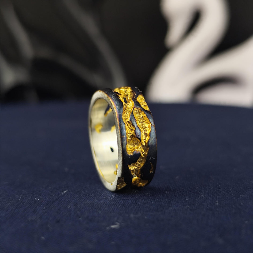 A handmade rustic ring with a unique oxidized and gold-plated finish, perfect for lovers of artistic and vintage jewelry. This textured statement band features an aged, distressed look, adding character and charm to any outfit. Whether worn as an everyday accessory or given as a meaningful gift, this unisex ring embodies raw beauty and craftsmanship, making it an elegant yet bold fashion piece.