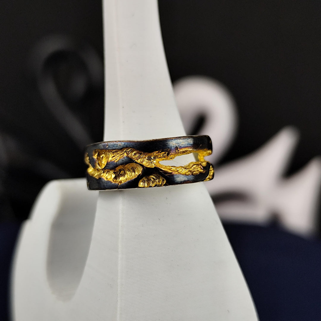 A rustic ring with a unique oxidized and gold-plated finish, handcrafted to achieve a striking vintage-inspired look. The textured surface gives it an aged feel, making it perfect for lovers of antique and artisan jewelry. Whether worn as a daily piece or a symbolic gift, this unisex ring blends rustic beauty with modern elegance, creating a versatile and meaningful addition to any jewelry collection.