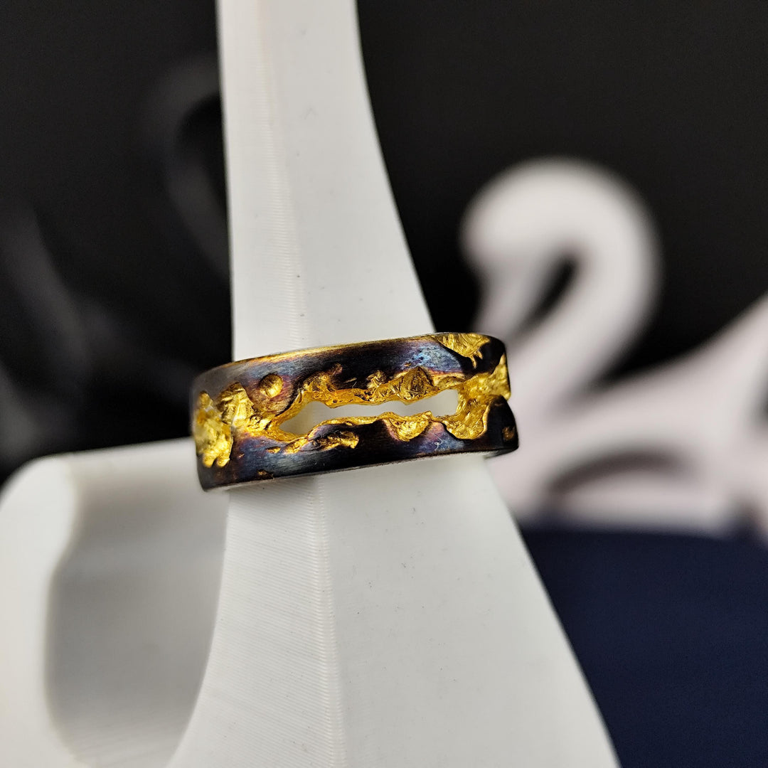 This rustic oxidized and gold-plated ring is a true one-of-a-kind piece, combining handmade craftsmanship with a bold, textured design. The vintage appeal of the aged oxidation meets the warmth of gold plating, creating a unique statement band. Whether for men or women, this jewelry piece is perfect for those who appreciate unconventional styles and raw elegance, making it an ideal everyday or gift-worthy accessory.